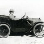 Herbert Austin driving and Austin Seven